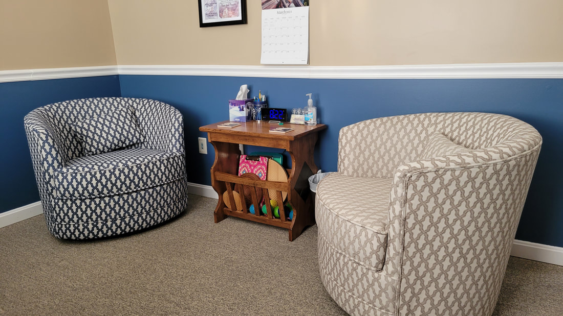 Comfy chairs in a Journey Well, LLC therapy room.